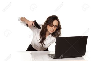 18384516-nervous-and-angry-secretary-destroys-your-laptop-by-using-guns-Stock-Photo